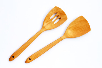 Wooden kitchen spatula on white background.