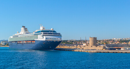 Fototapeta na wymiar Rodes, GREECE - MAY 2019: Costa NeoClassica Cruise Ship leaving the port of Rhodes, Greece