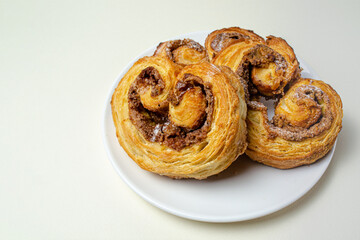 French sweet bun. On a white plate High quality photo