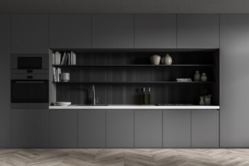Dark grey kitchen cabinet with lining in the niche