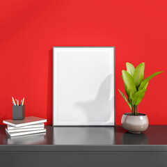 Photo frame or art work at the red wall on grey surface
