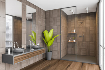 Corner of dark beige shower room with big green plant