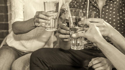 Group of happy friends drinking beer at brewery bar restaurant - Friendship concept with young people having fun together at cool places - Focus on glasses