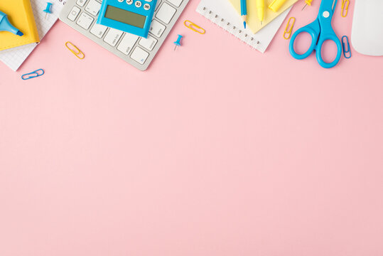 Top view photo of blue and yellow stationery organizers pencil marker clips pins scissors stickers calculator keyboard mouse on isolated pastel pink background with copyspace