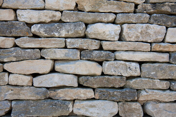 Dry stone wall background in shades of grey
