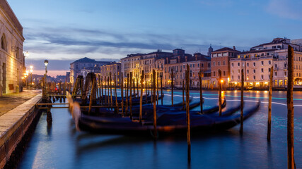 Venice city Grand Canal at sunset with gondolas and trails