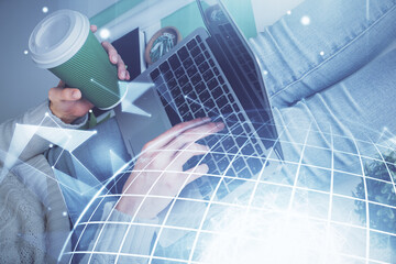 Double exposure of woman hands working on computer and world map hologram drawing. International technology business concept.