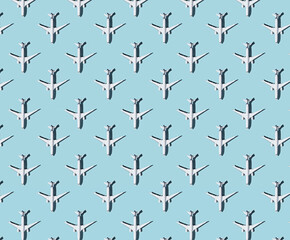 Pattern of plane models on blue pastel background