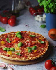 Pizza with salami and basil