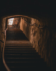 Stairs up out of the tunnel where the golden sun shines. Dramatic feeling. Hiiumaa, Estonia