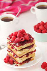 Sandwiches with peanut butter and raspberry jam