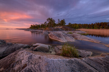 Stone shore of Lake Ladoga on a summer evening