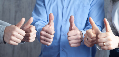 People showing thumb up gesture. Success