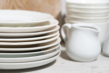 tableware, cutlery and kitchen utensils on white background