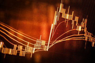 Abstract financial trading graphs and digital number of foreign exchange market trading on monitor. Background of gold and blue digital chart to represent stock market trend.	
