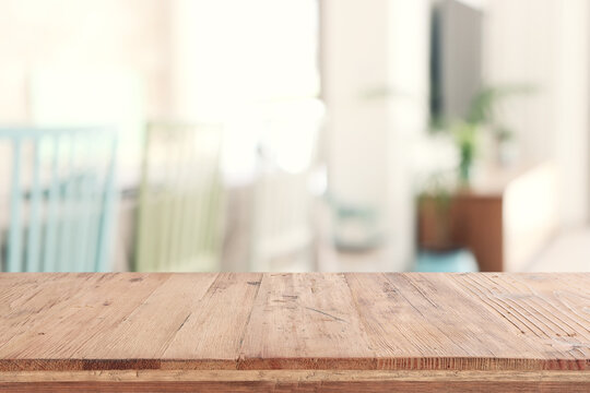 empty table board and defocused indoor background. product display concept