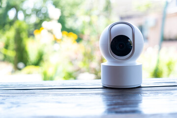 Video surveillance equipment on the table. Compact security camera for outdoor or private home security