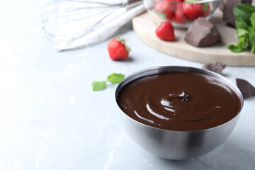 Delicious chocolate cream on light grey marble table, space for text