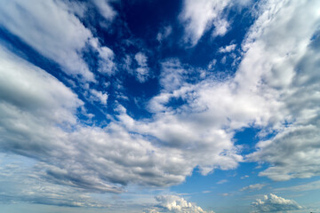 Fototapety  Summer Blue Sky and white cloud white background. Beautiful clear cloudy in sunlight calm season. Panoramic vivid cyan cloudscape in nature environment. Outdoor horizon skyline with spring sunshine.