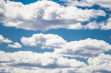 Bright Clouds on the blue sky showing white soft texture pattern.