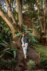 woman tourist posing in tropical park 