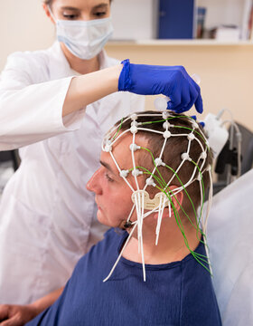 Patient brain testing using encephalography at medical center