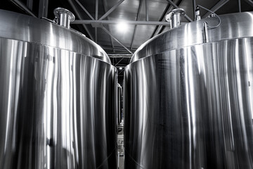 Rows of steel tanks for beer fermentation and maturation in a craft brewery