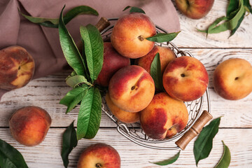 Naklejka na ściany i meble Fresh ripe juicy peaches on white wooden table, flat lay