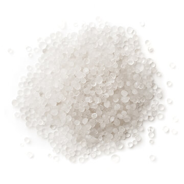 White plastic, polymer pellets for the production of plastic products, isolated on a white background