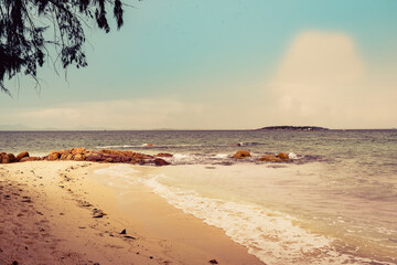 Nature in twilight period which including of sunrise over the sea and the nice beach. Summer beach with blue water and purple sky at the sunset.	
