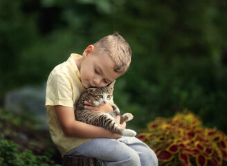 little child playing with a cat