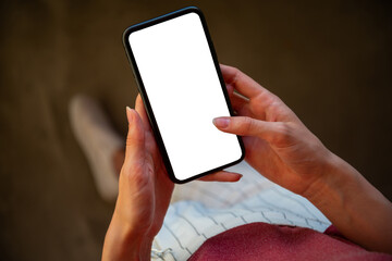 Woman using mobile phone, empty mockup screen for your own design