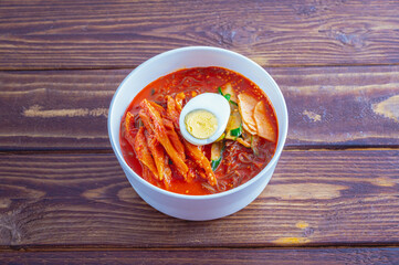spicy buckwheat noodles with marinated dried pollack, Korean food 'kodari naengmyeon'