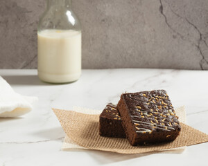 chocolate brownies on dark and white background homemade bakery and dessert white marble top view flat lay looking down with text space copy space