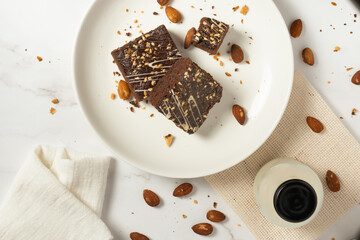 chocolate brownies on dark and white background homemade bakery and dessert white marble top view flat lay looking down with text space copy space