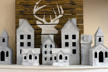 Empty old houses and the silhouette of a deer