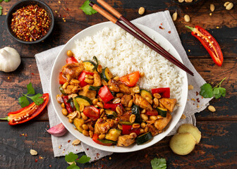Kung Pao Chicken with Peppers, zucchini and rice. Asian take away food