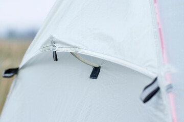 Ventilation window in a tourist tent is open and was fixed it with a velcro. © imartsenyuk