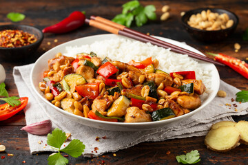 Kung Pao Chicken with Peppers, zucchini and rice. Asian take away food