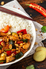 Kung Pao Chicken with Peppers, zucchini and rice. Asian take away food
