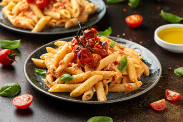 Baked sweet cherry tomatoes and Greek feta cheese fussily pasta. Trendy Vegetarian food