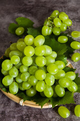 fresh ripe green grape on marble dark background.