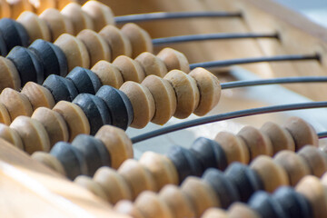 Old hand abacus close-up. Accounting work, financial transactions.