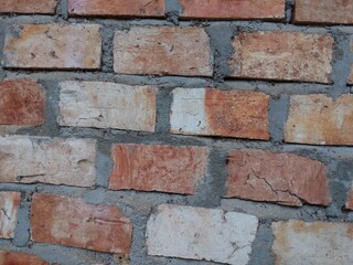 The walls of the residents' houses are made of bricks.