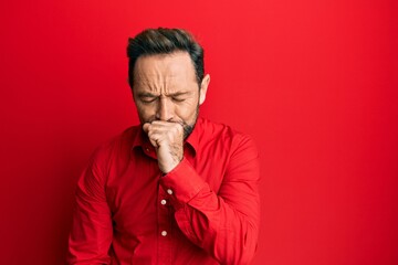 Middle age man wearing casual clothes feeling unwell and coughing as symptom for cold or bronchitis. health care concept.