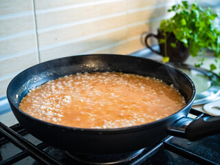 Risotto cooking in pan
