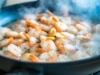 Shrimps frying in pan 
