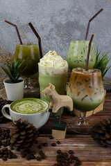 Fresh milk green tea menu is placed on a wooden table. The background is a polished wall. beautifully arranged Suitable for making menus - 443234288