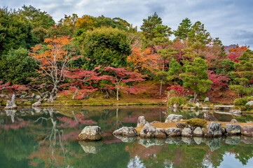 Autumn forest of Arashiyama ,still water reflection in World HeritageTenryuji Temple Arashiyama Kyoto.