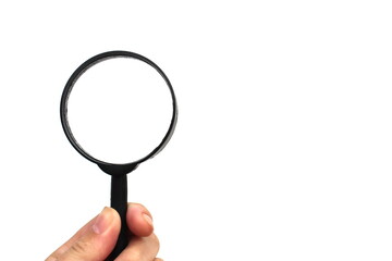 Female hand holding a magnifying glass on white isolated background